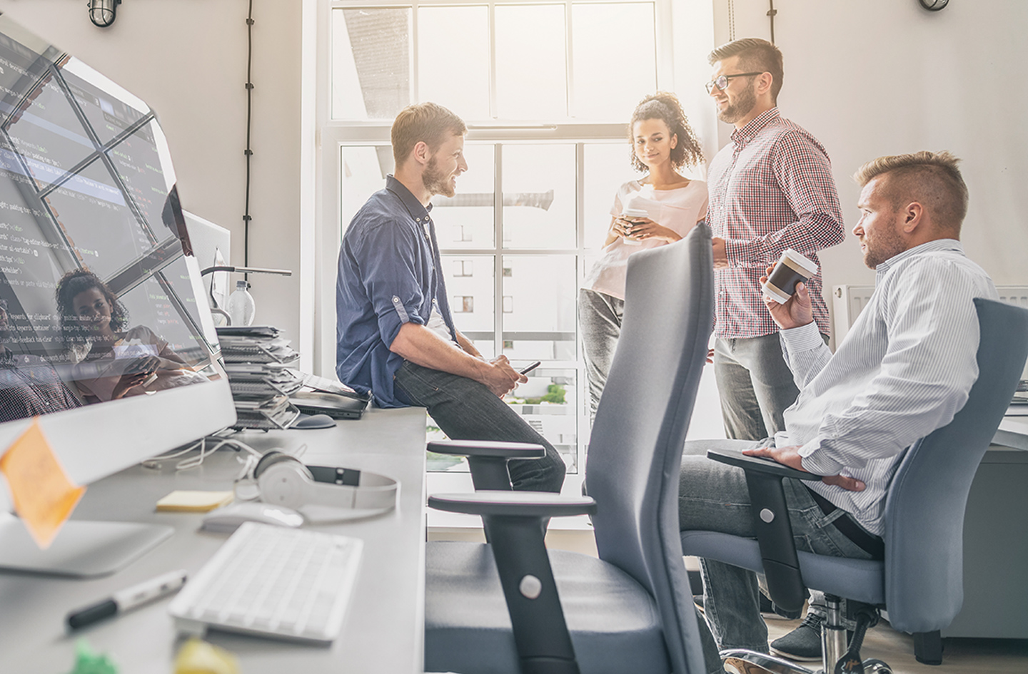 Group of coworkers around desks