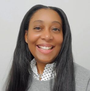 Woman wearing gray sweater with long black hair